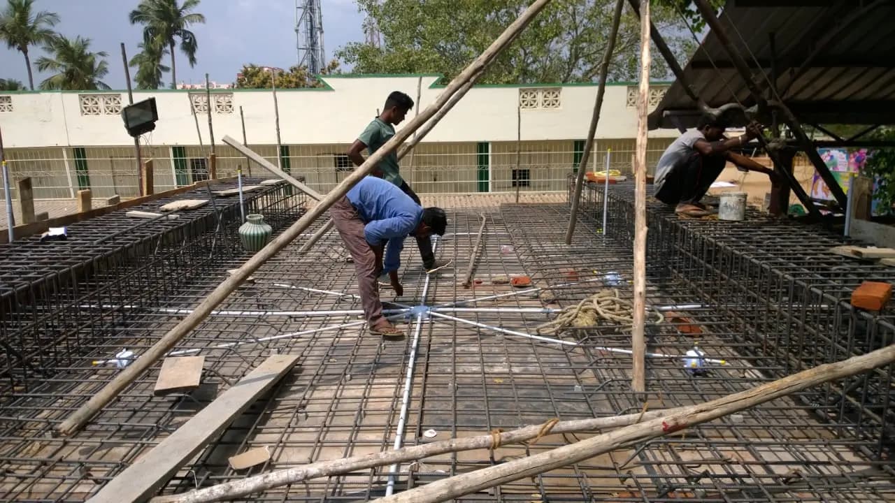 Concealed electrical conduit laid inside roof slab reinforcement before concreting